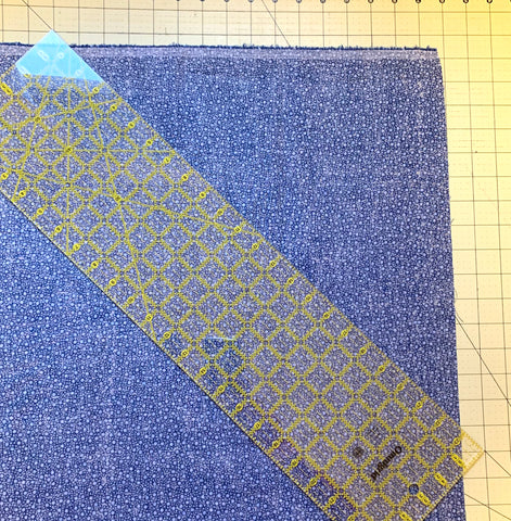 Ruler angled and fabric straight