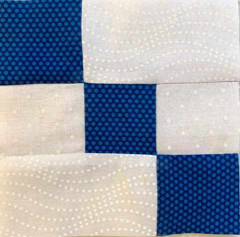Next section. Looks like a small part of an Irish Chain with white and blue squares