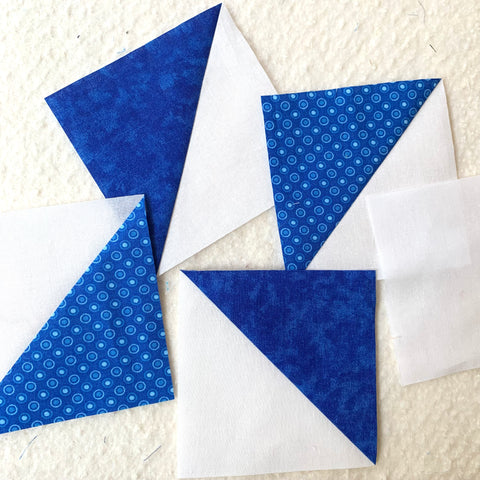 Half Square Triangles ready to be sewn together