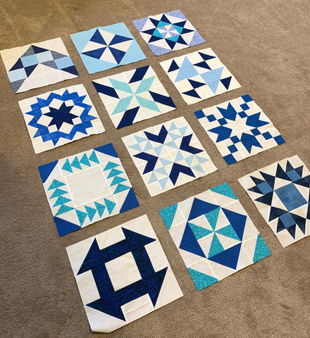 Crib size quilt top laid out with spaces for sashing