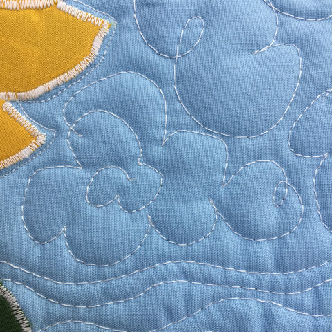 Quilting on sunflower mini quilt