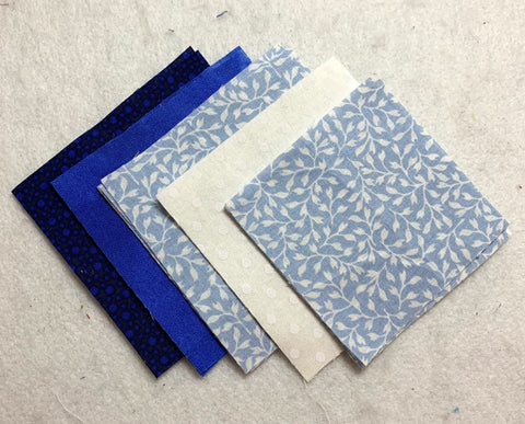 Squares of fabric cut out to make the block