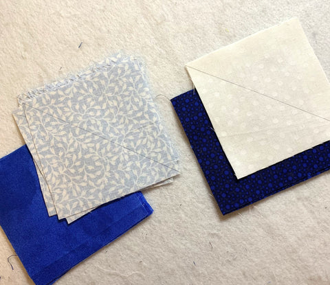 Fabric squares ready to be sewn