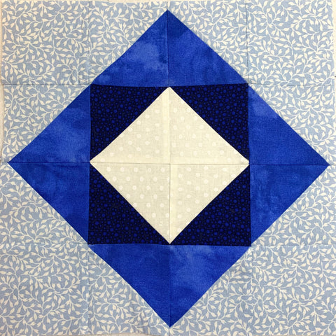 The Shadow Box Quilt Block made in a variety of blues
