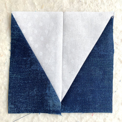Two half rectangle triangles sewn together to create points of the star