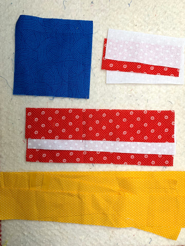 Pieces cut out for the quilt block