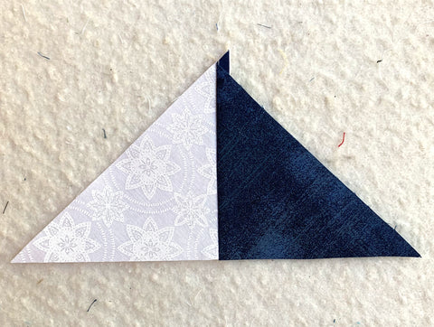 Two triangles sewn together