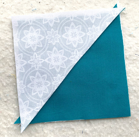 White triangles matched up with a Teal triangle