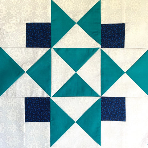 Four Corners Quilt Block in Teal, Navy, and White