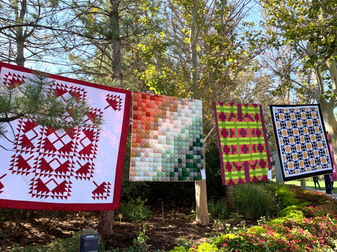 Quilts hanging in the trees