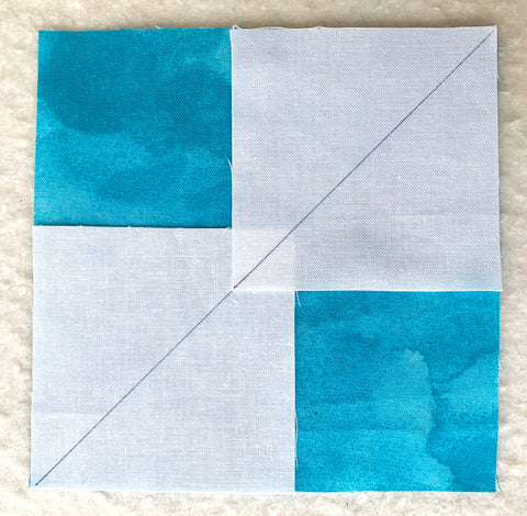 White squares on a teal square