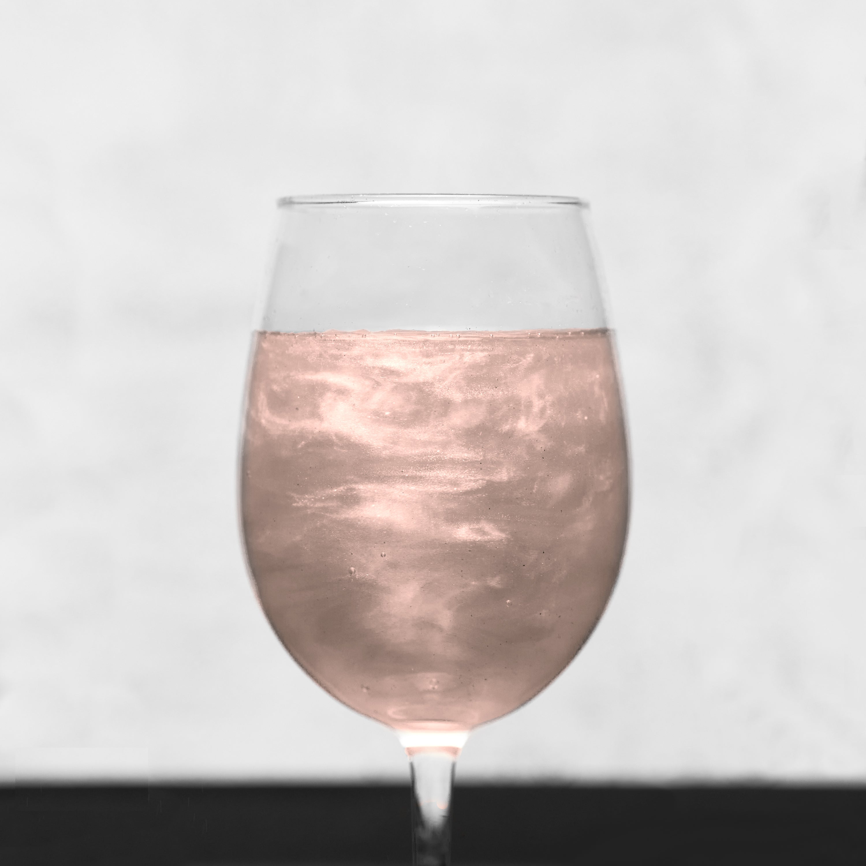 champagne float with peach edible glitter