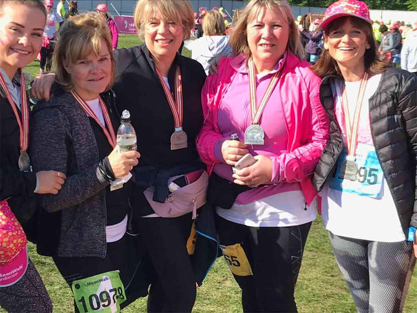 Group-of-five-women-standing-together-in-sports-wear-after-completing-the-Moon-Walk-2019