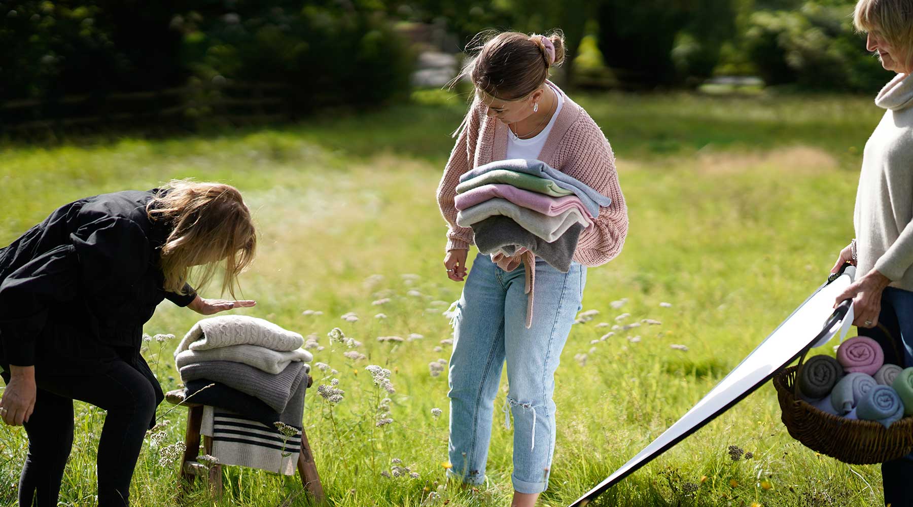 behind the scenes setting up still life shot in meadow