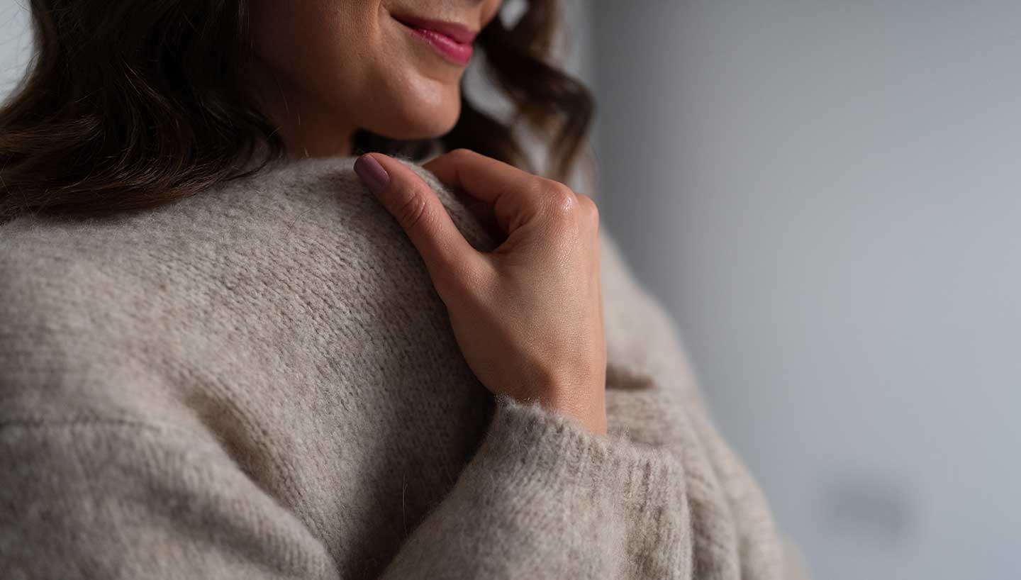 cosy neutral cashmere cardigan worn with cashmere loungewear.jpg