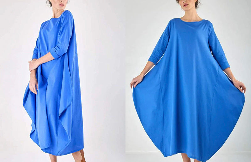 Bright blue, loose-fitting bohemian maxi dress with long sleeves.