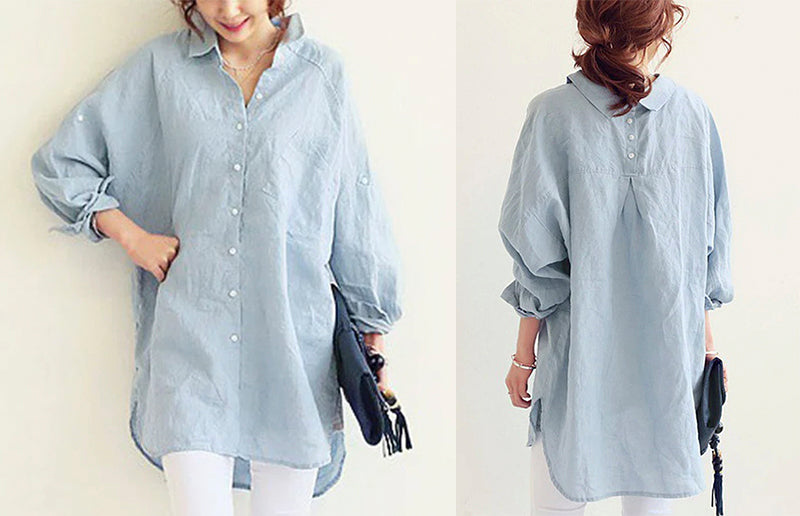 a woman wearing an oversized linen shirt in light blue