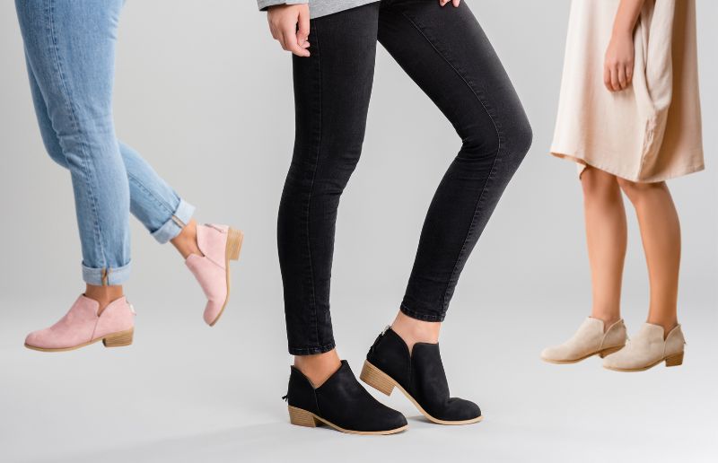 Stylish pink booties, black slip-ons, and cream loafers showcased.