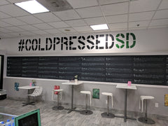 Coldpressed Brand Logo Stenciled on Store Wall