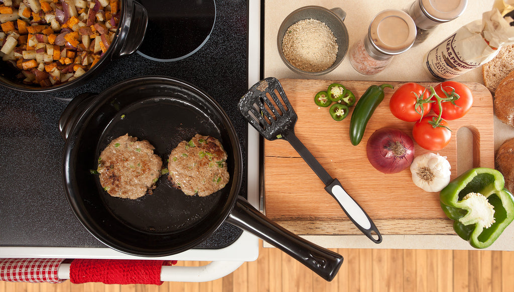 two turkey burgers in skillet