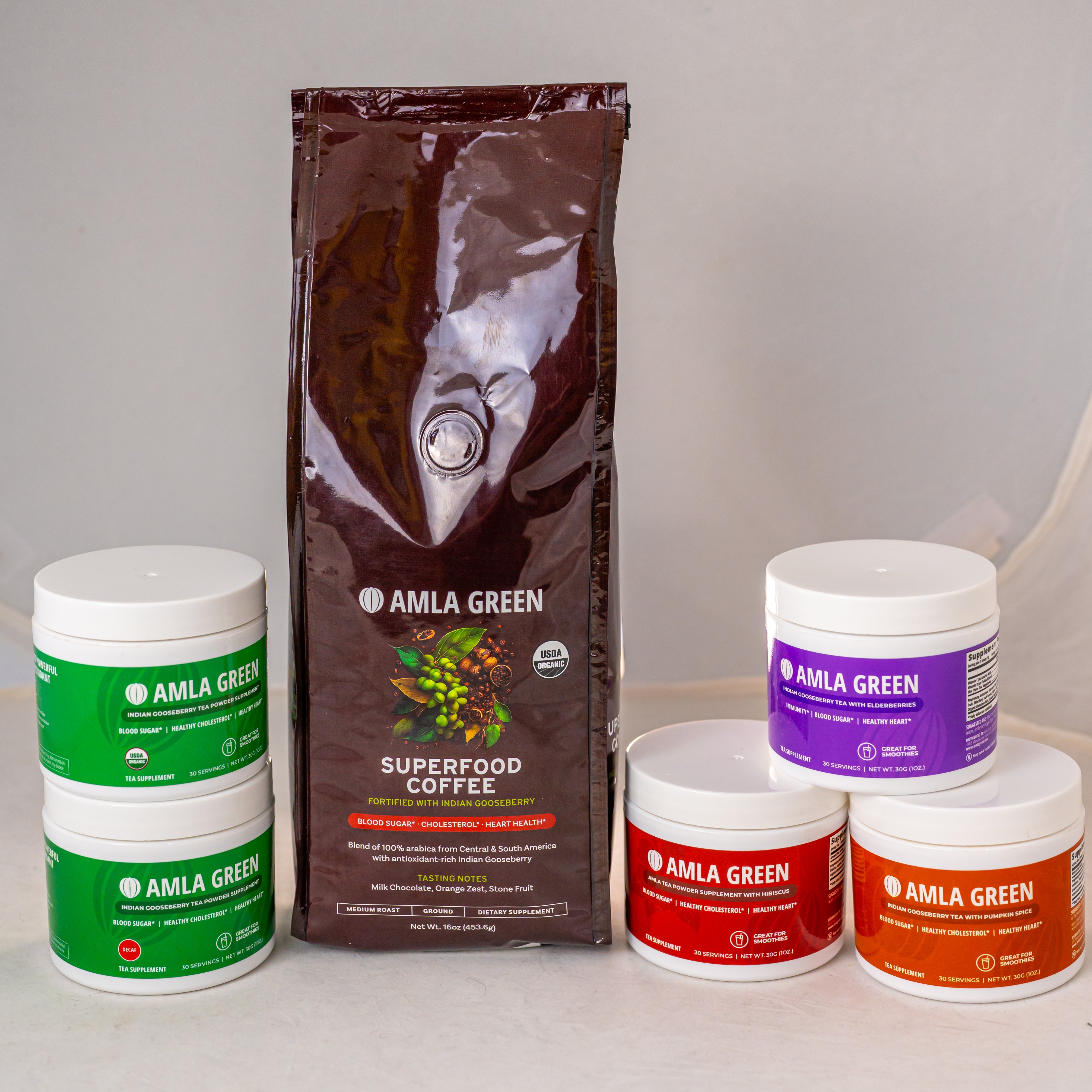 A variety of Amla Green products including Superfood Coffee and various supplements in tubs.