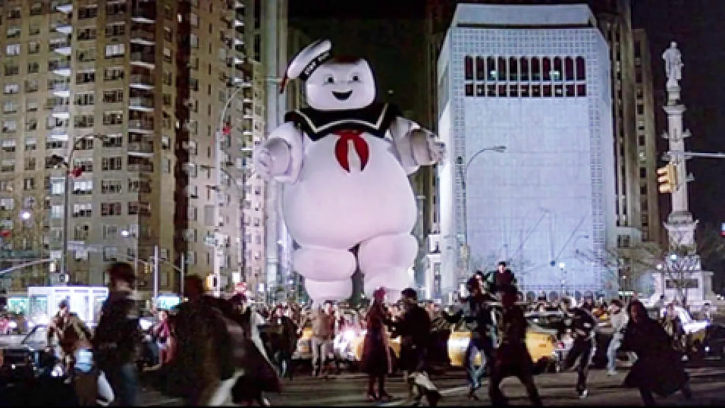 stay puft marshmallow man towering over new york city