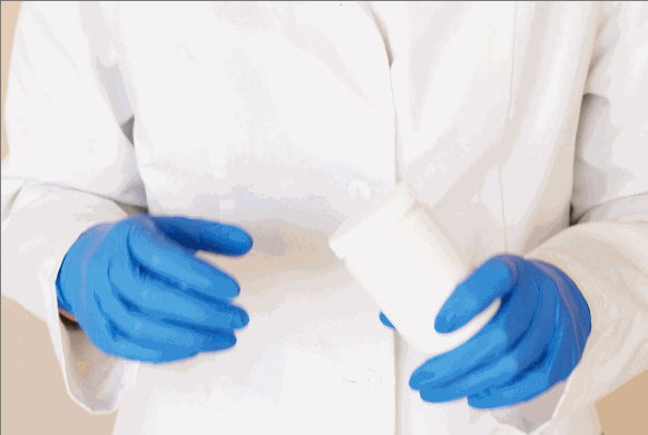 straight open cuffs on a lab coat hanging down exposing skin while opening a jar