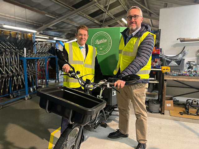 Andy Street and Adam Tranter standing with the ALECS e-trike in the Pashley Factory.