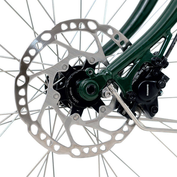 Close-up of a front disc brake on a bicycle.