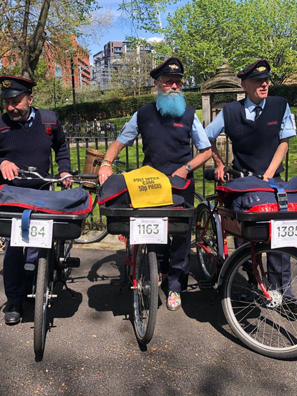 3 postman with their Pashley post bikes on the London Tweed Run.