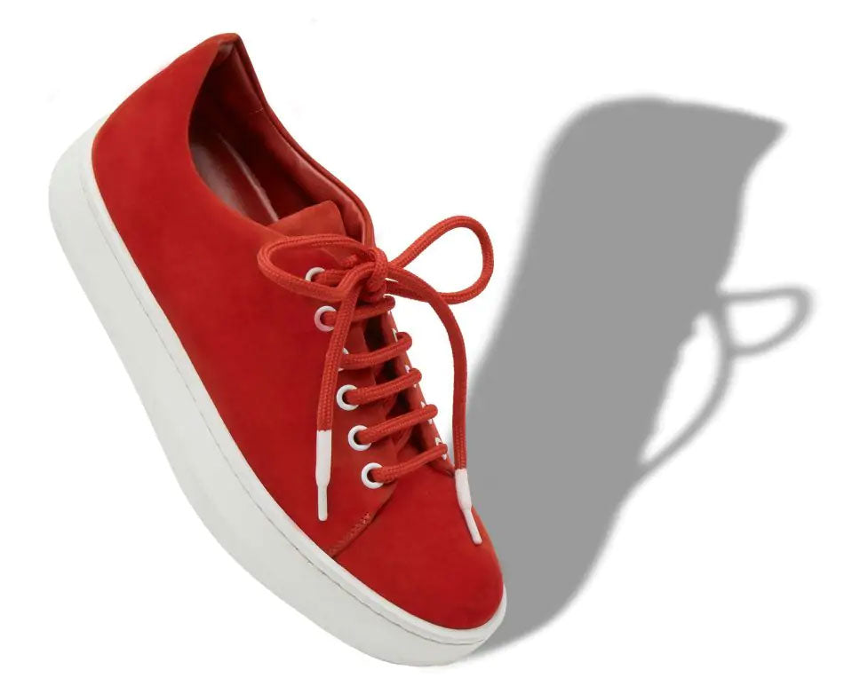 Angled view of a right red Manalo Blahnik sneaker with white sole and red laces.