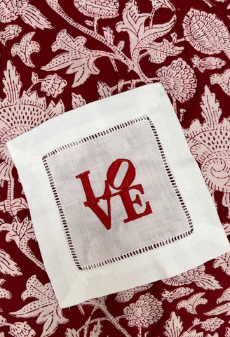 Linen hemstitch cocktail napkin with Robert Indiana-inspired LOVE motif