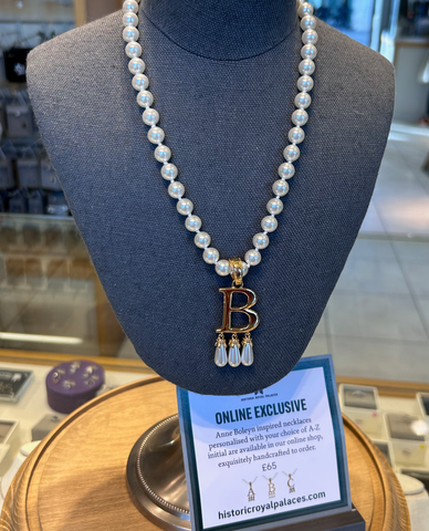 Monogram necklace inspired by Anne Boleyn on sale at the Tower of London gift shop