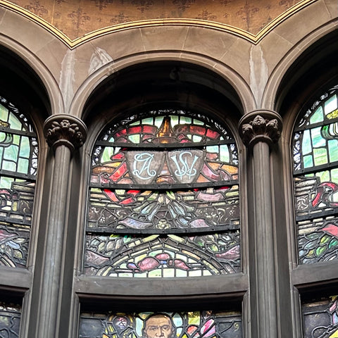 stained glass windows at Skibo Castle with the monograms of Andrew Carnegie and his wife