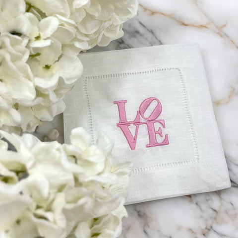 Embroidered love cocktail napkins inspired by Robert Indiana Love Square sculpture