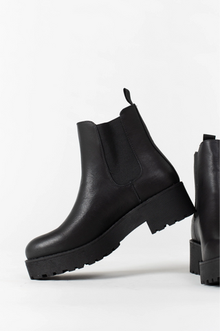 A pair of black leather platform boots