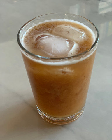 Tall glass of Tamarind Drink with Ice