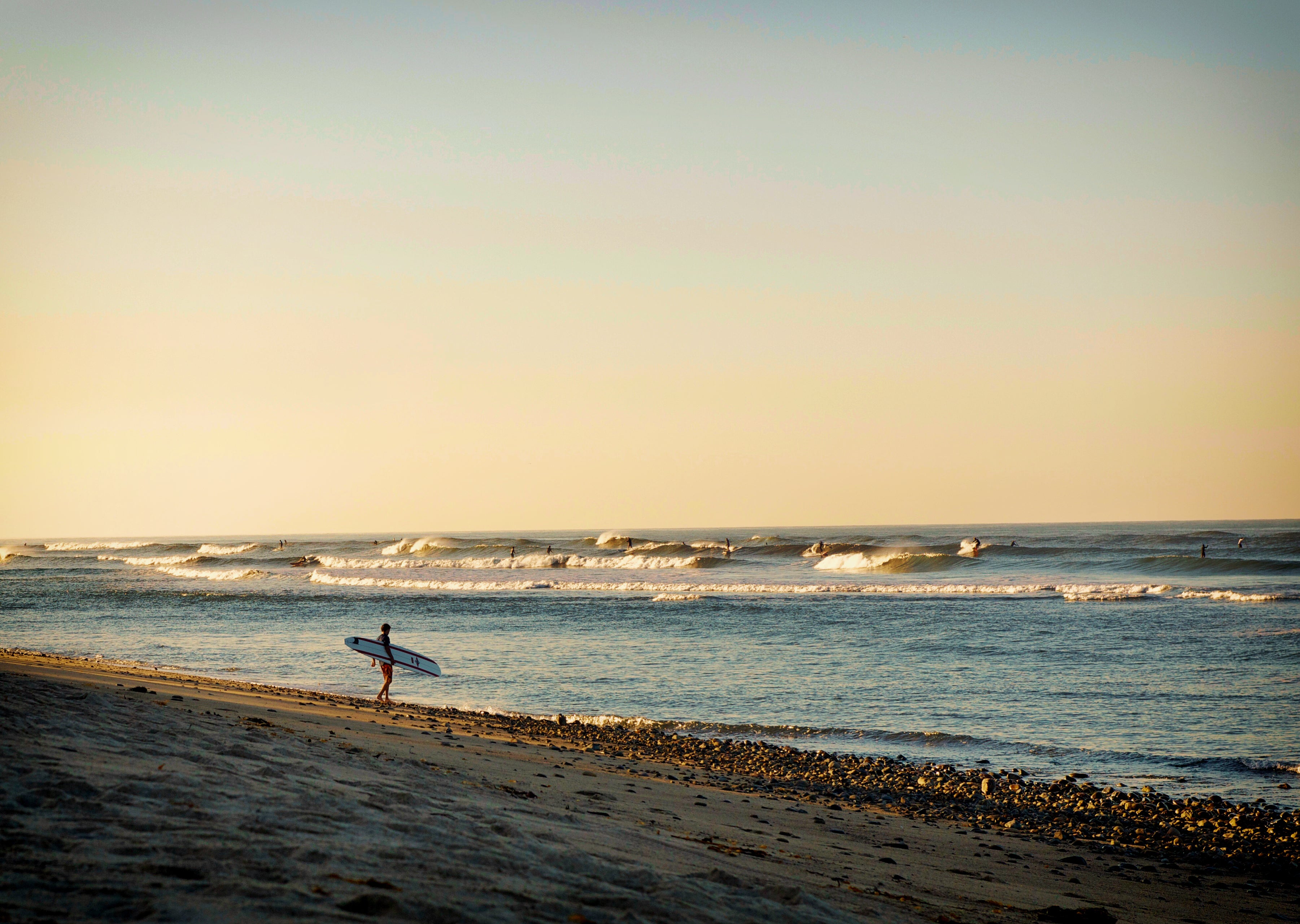 tips for vacation photos early morning surfer on the beach