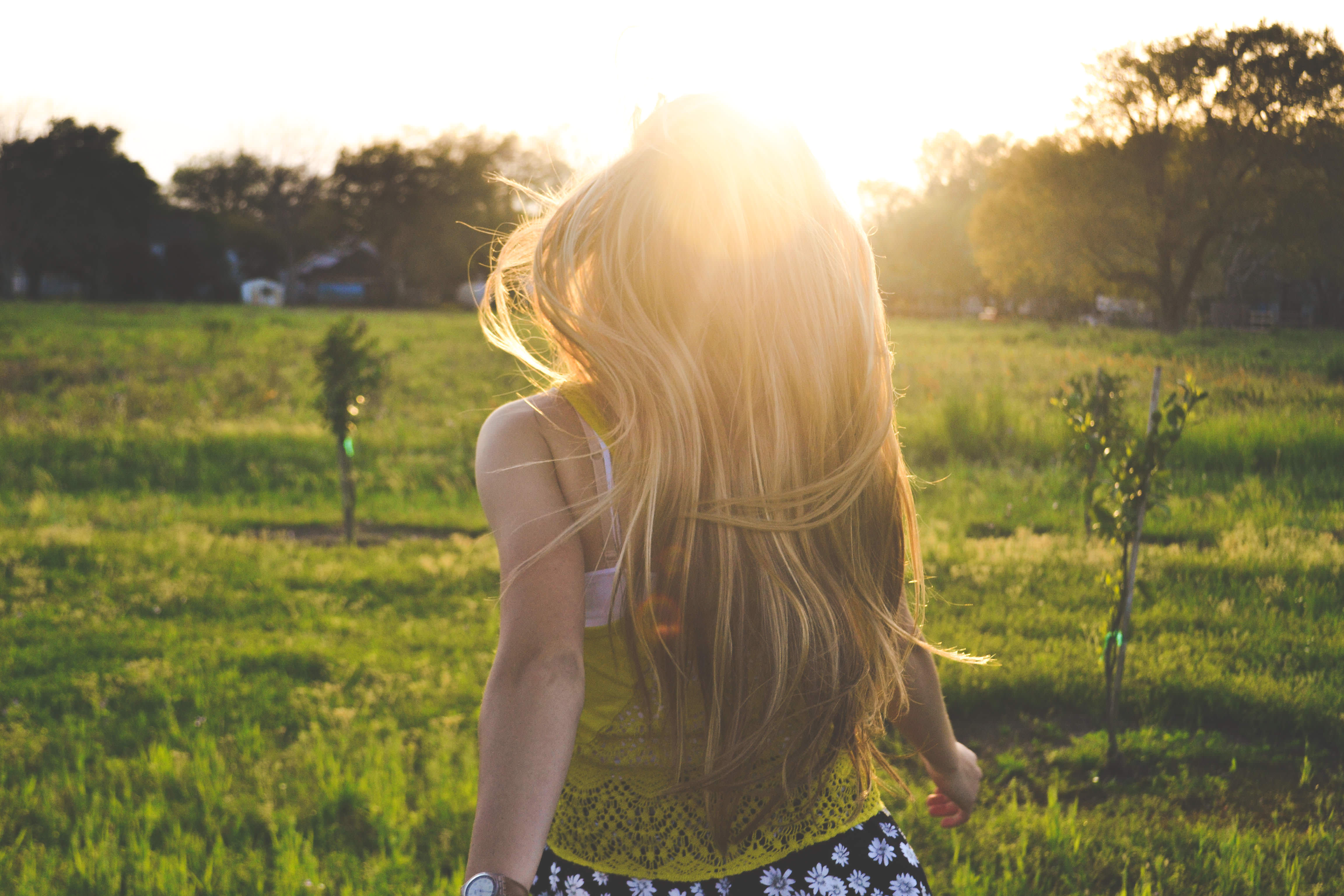 Girl running through a grassy field. A photo by Morgan Sessions. unsplash.com/photos/TS2UKluECVE