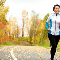 asian_woman_jogging_fall_autumn_leaves_outside_happy_pic