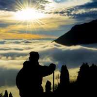 man_mountain_climb_sunrise_clouds_hike_pic