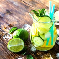 water_pitcher_alkaline_lemon_lime_mint_wood_table_pic