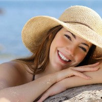 woman_young_smooth_skin_ocean_beach_hat_sun_pic