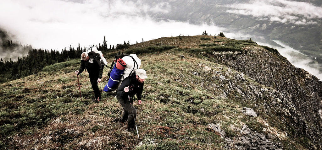 Two hikers with ultralight backpacks