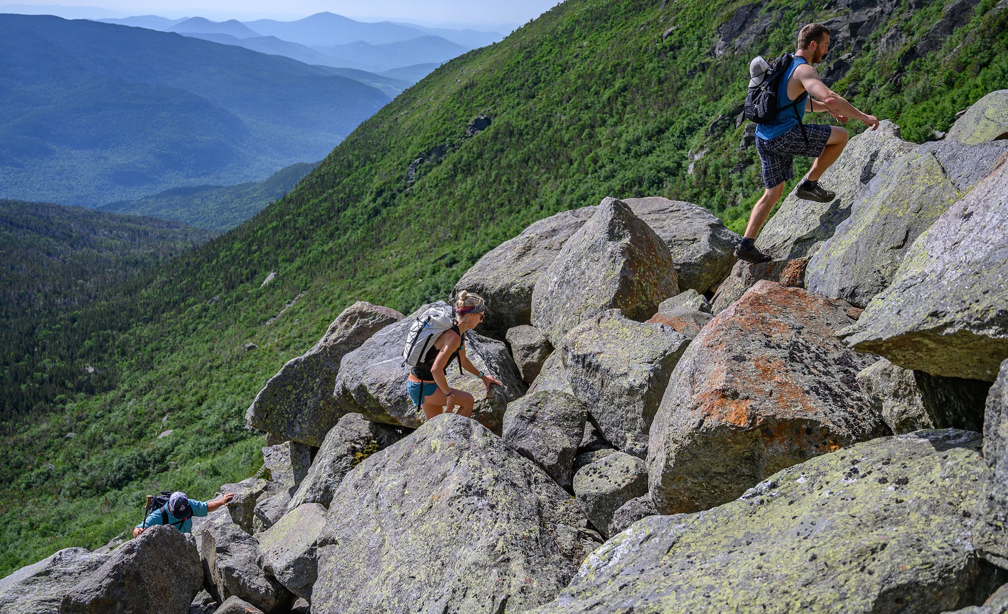Ultralight backpackers climbing Mount Washington
