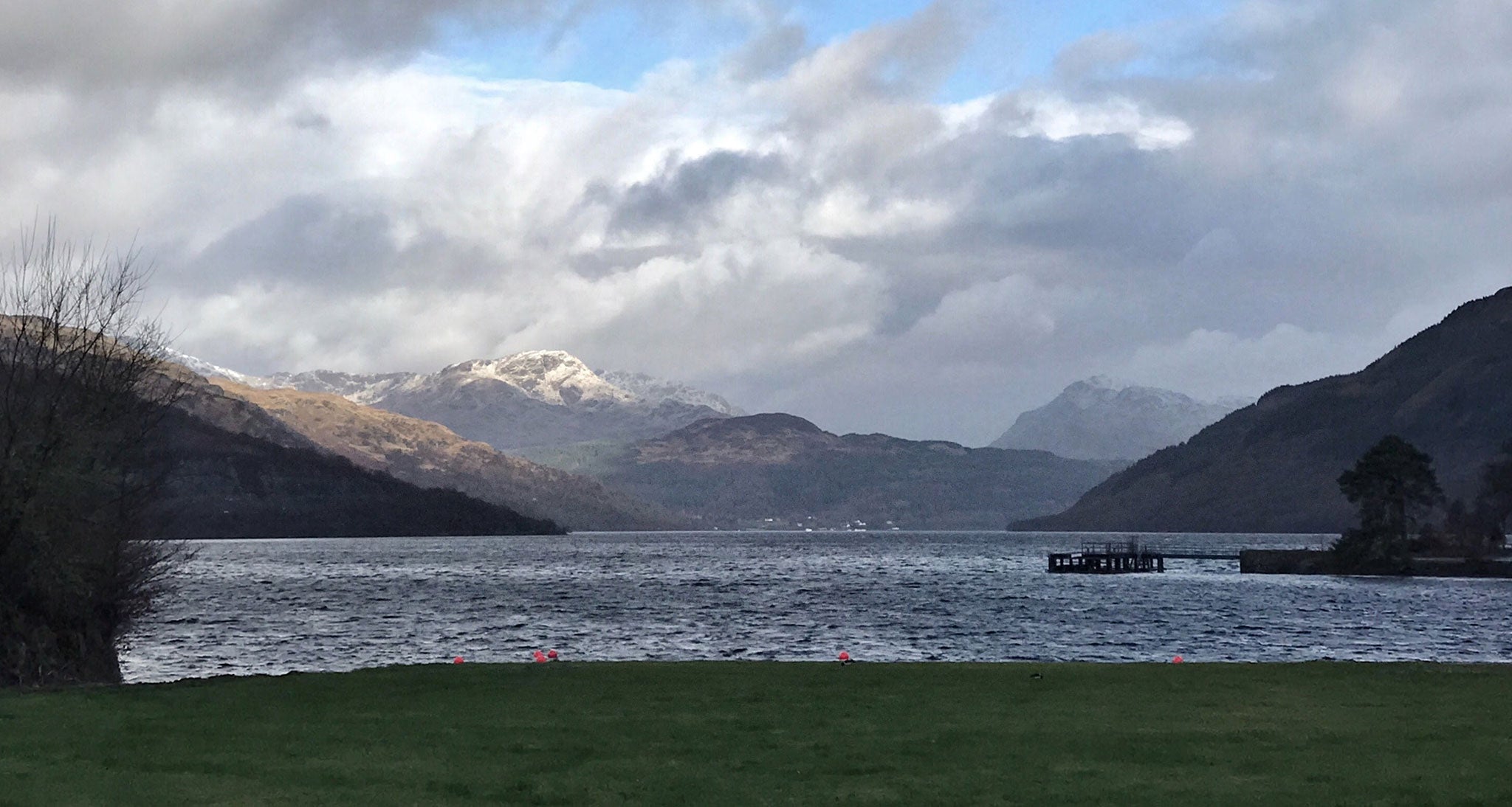 Lake photograph with a backdrop of the Highlands