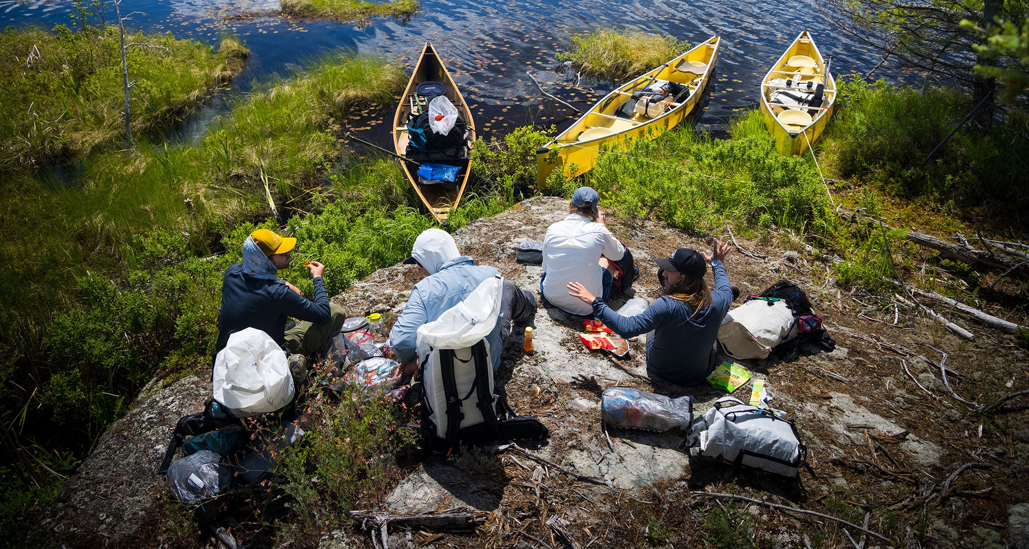 Canoes in the water, crew packs up for departure