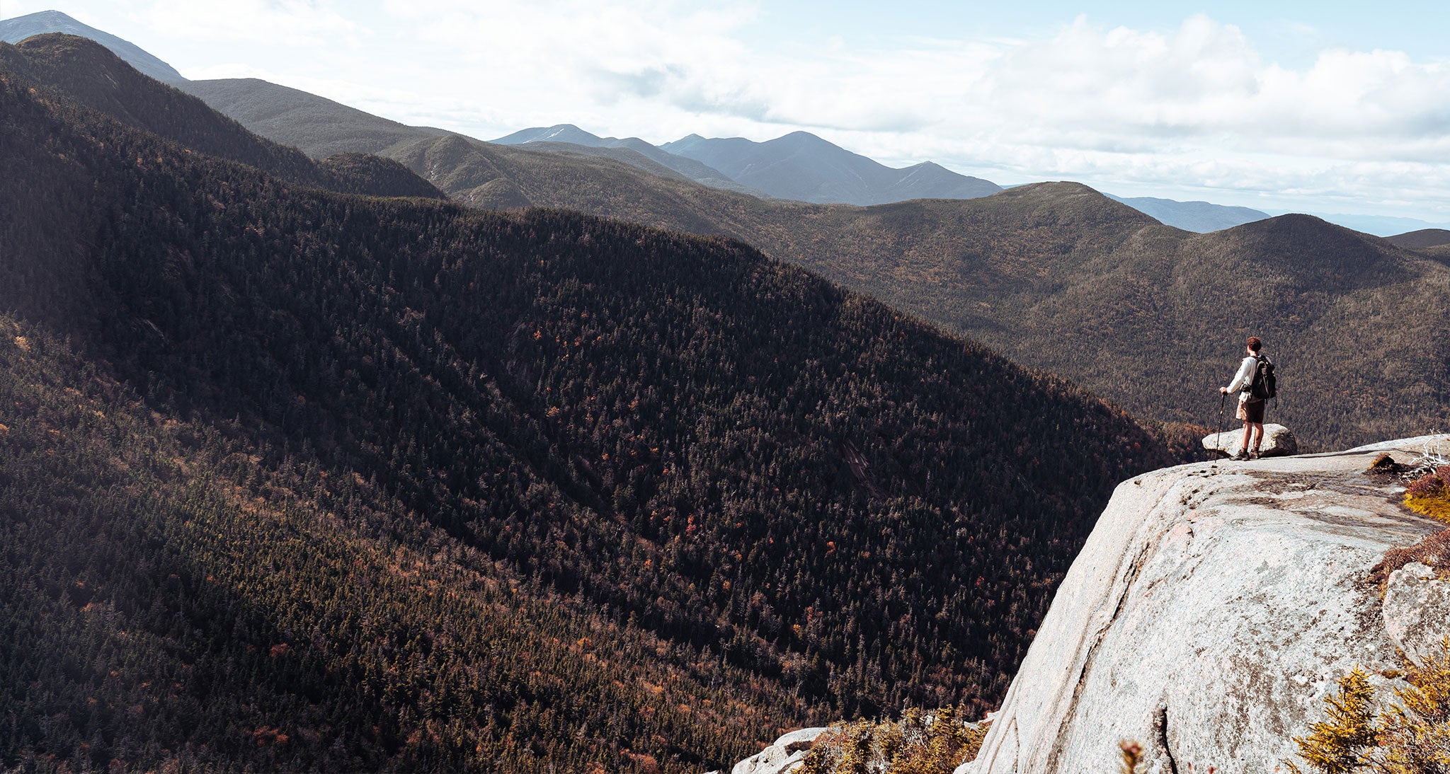 Hiker overlooking the valleys below