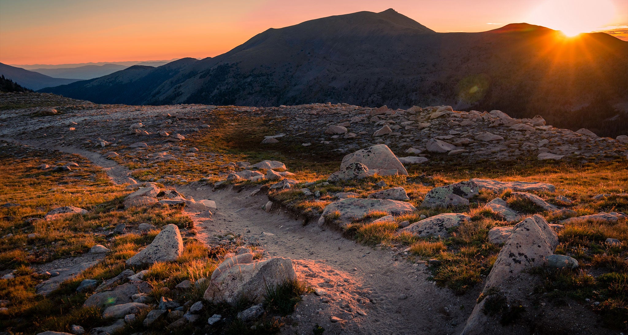Sunset over a rocky trail