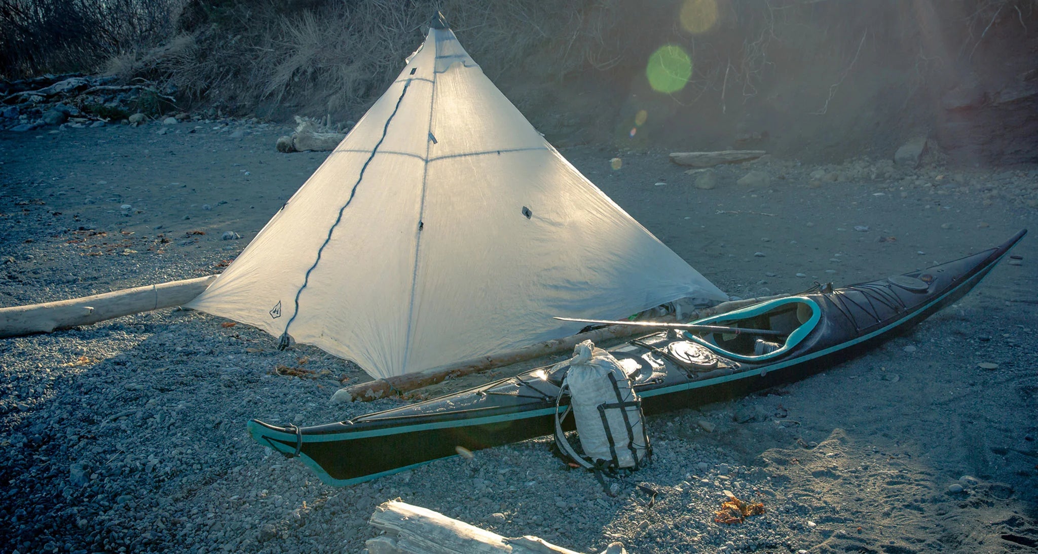 Ultamid tent and pack at camp with sea kayak